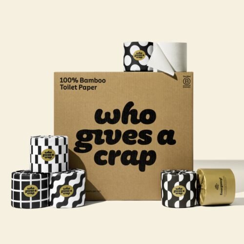 A large box of Who Gives A Crap 100% Bamboo Toilet Paper with black and white wrappers - eco-friendly, biodegradable and sustainable toilet paper